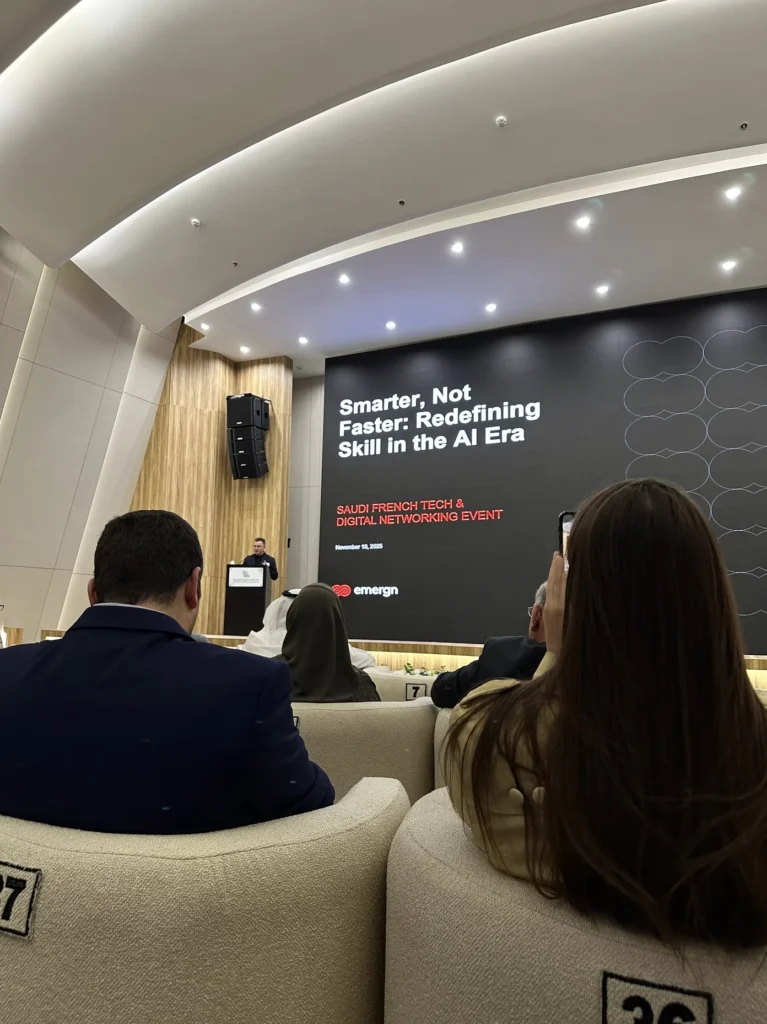 Speaker presenting on artificial intelligence skills at a Saudi French Tech networking event.