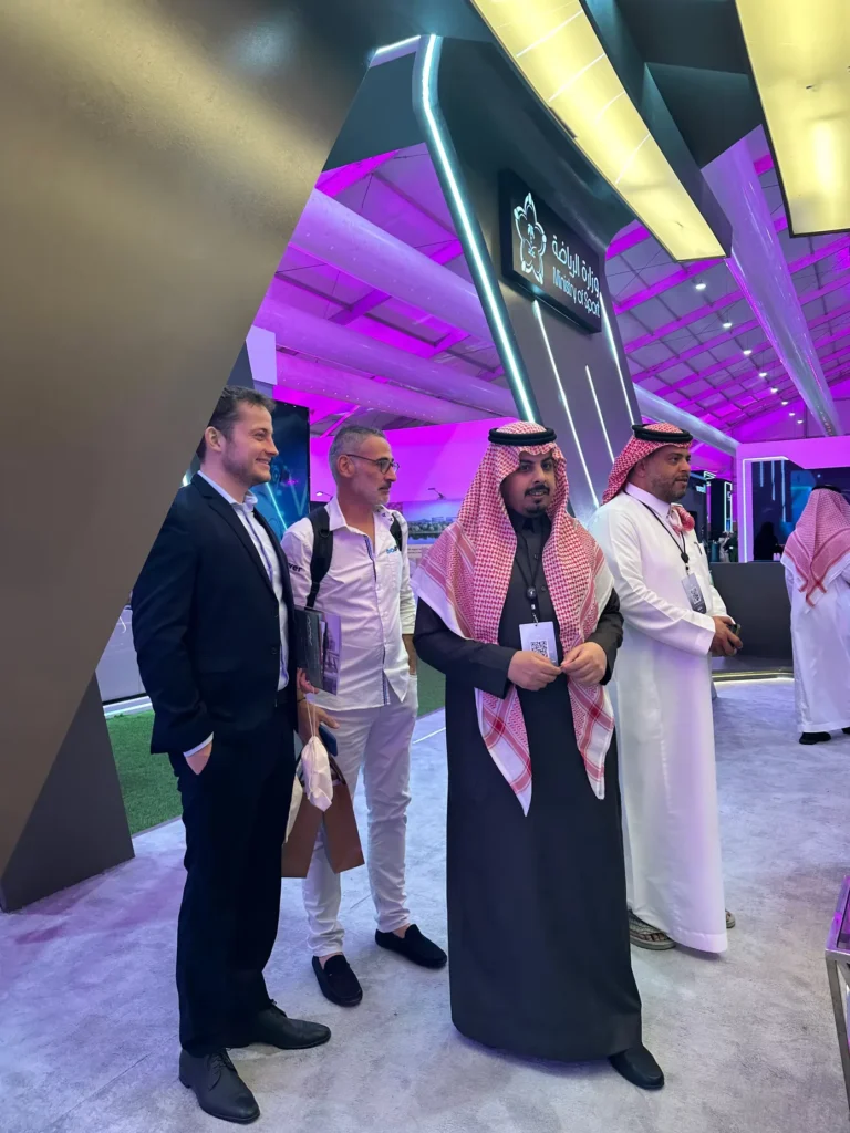 International visitors meeting Saudi representatives at the Ministry of Sport stand.