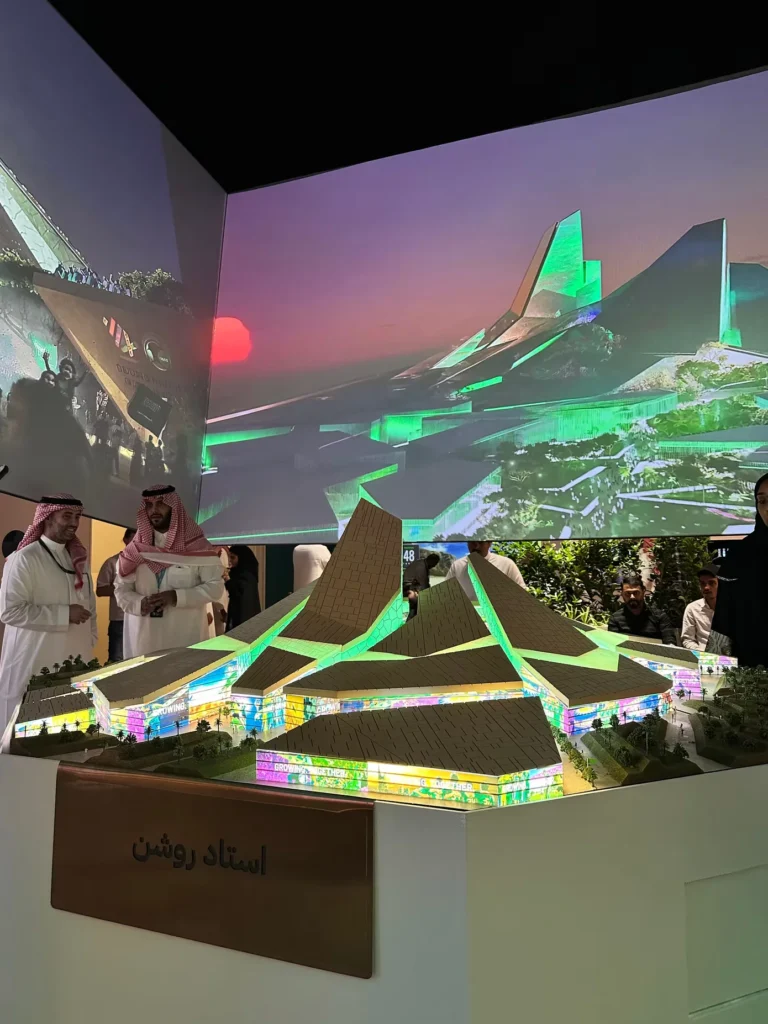 Illuminated architectural model of a major Riyadh sports and entertainment venue.